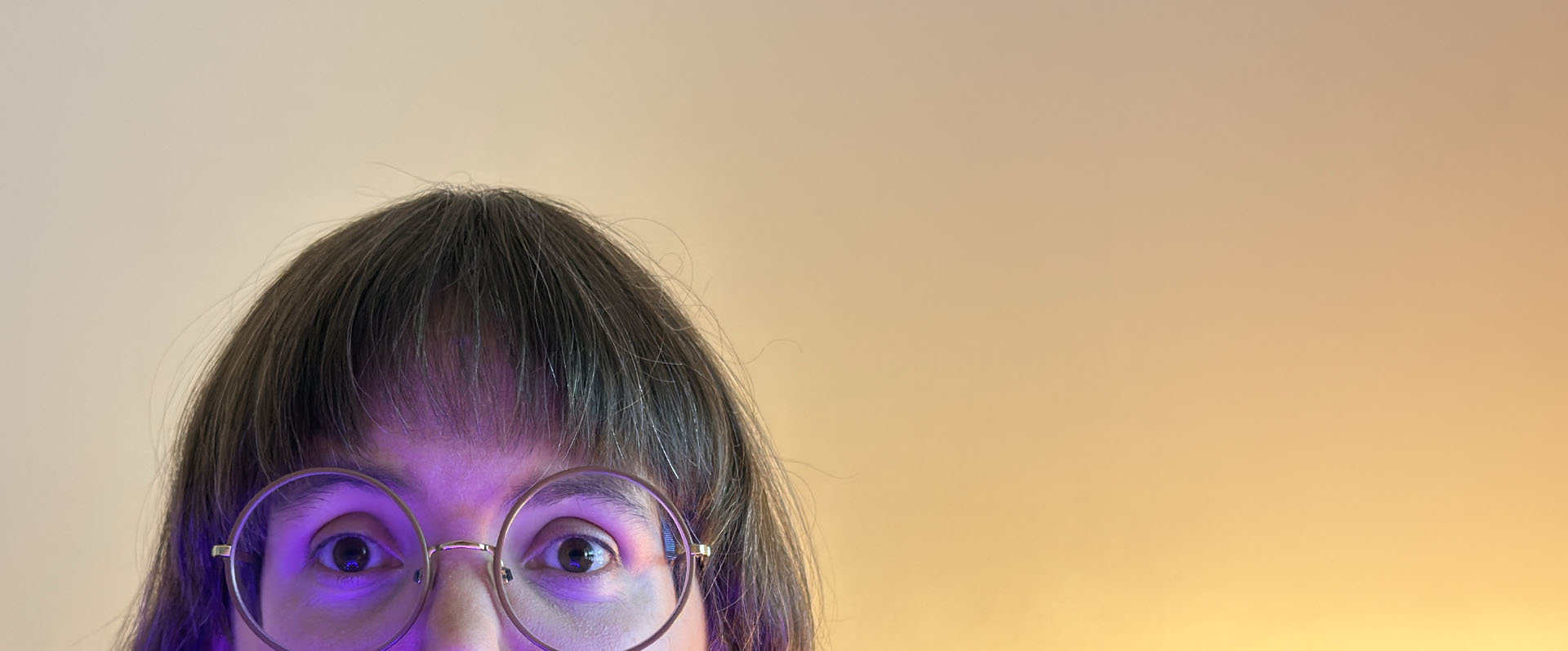 Face peeking up from behind screen