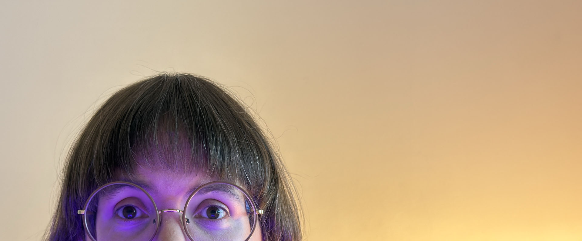 Face peeking up from behind screen