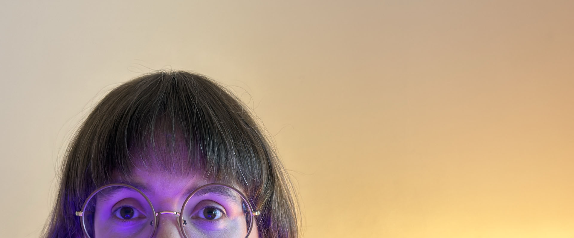 Face peeking up from behind screen