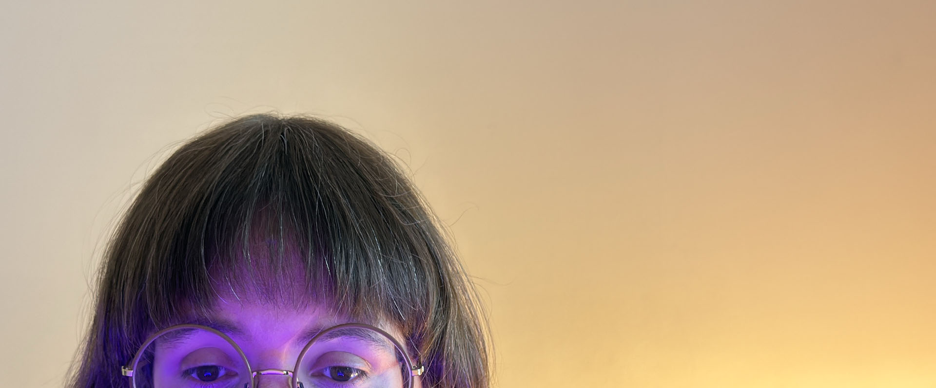 Face peeking up from behind screen